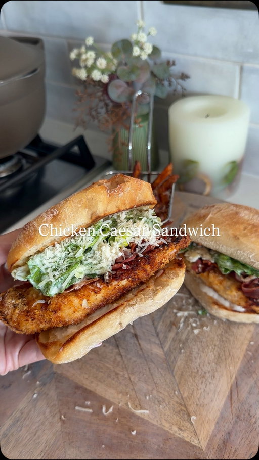 CHICKEN CAESAR BURGERS 

a delicious dinner or lunch option for the warmer weather ☀️

Follow @kimberlys_journeyy for more recipes like this⤵️

To make the chicken:
- 400g chicken breast 
- 25g panko breadcrumbs 
- 10g parmesan 
- 1 whisked egg
- 1tsp smoked paprika, garlic granules & chicken seasoning 

The burgers:
- two ciabatta buns 
- Chopped romaine lettuce
- 2tbsp light caesar dressing 
- 10g parmesan 
- 2tbsp hot honey
- 2 sliced cooked bacon medallions 

Mix together the panko breadcrumbs with parmesan and half of the smoked paprika, garlic granules and chicken seasoning.

Butterfly your chicken breasts and slice them so they are nice and thin. Sprinkle over the rest of the seasonings.

Then dip each piece into the whisked egg, then coat well in the breadcrumb mix, pressing it on so it sticks.

I cooked mine in the air fryer at 200°C for 12–15 mins, flipping halfway, until golden and crispy (or pan fry for 4–5 mins each side until cooked through).

Slice and lightly toast your ciabatta buns until golden but still soft.

Mix the chopped romaine lettuce with the caesar dressing and parmesan.

Add the chicken to the bottom of your ciabatta rolls, top with the salad and finish with the bacon medallions and a little extra parmesan.
