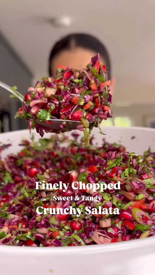 TWO YEARS since I posted this salata after it stood idle on my blog and YT channel for years. Get this on your dinner tables tonight - who’s made this one already? Ok, what are you having for (lunch) or dinner tonight because this is THE perfect salad to have on repeat, now and always 💚🧡❤️💜 chop EVERYTHING as finely as possible (except for the pomegranate seeds and dressing ingredients obvs) and you will notice ALL the difference - dare I say, it’s even better the next day! #pleasemakeit

INGREDIENTS
250g red cabbage, finely diced
1/2 English cucumber (deseeded) / 2 medium middle-eastern cucumbers (deseeded), finely diced 
1 large red Romano pepper / kapya biber, finely diced
2 spring onions, finely sliced 
50g fresh coriander, very finely chopped (stalks and leaves)
200g pomegranate seeds
3 tbsp extra virgin olive oil
2 tbsp freshly squeezed orange juice 
1 tbsp white wine vinegar 
2 tsp dried mint 
1 tsp honey 
2 tbsp pomegranate molasses 
1/2 tsp sea salt flakes (or more to taste) 

#melizcooks #salad #choppedsalad #finelychopped