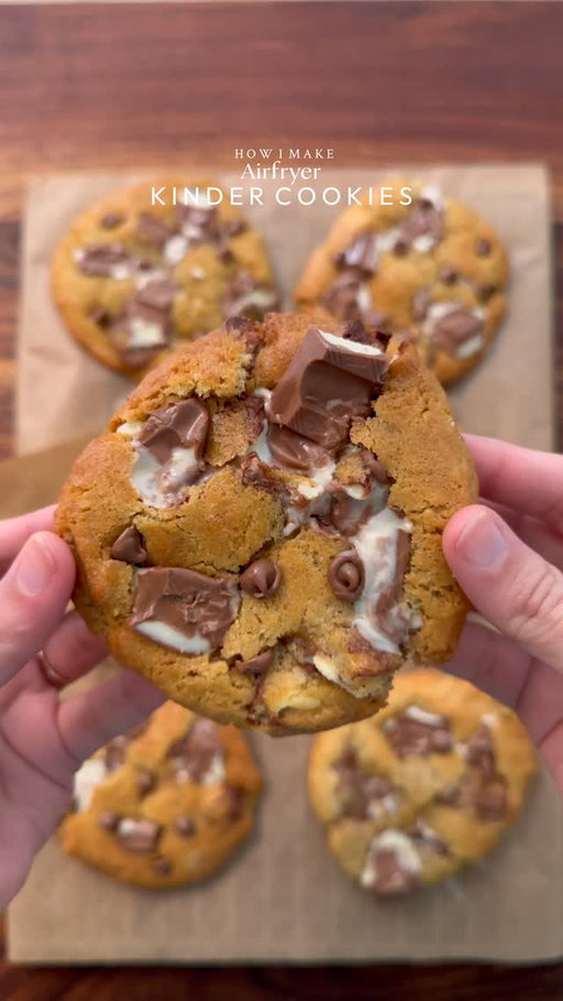 Crispy edges, soft and gooey center Airfryer kinder cookies 

I made this using @typhur_culinary Dome 2 Airfryer. It bakes evenly and gives that perfect crisp every time. Fast, efficient, and honestly makes baking so much easier. You can use my code
‘COOKWITHSHA’ to get 10% off😉

Yields: 8-9Cookies
INGREDIENTS:
•115g cold chopped unsalted butter
•80g caster sugar
•80g light brown sugar
•150g Kinder chocolate, chopped into chunks, plus an extra 50–60g for topping after baking.
•238g plain flour 
•½ tsp salt
•1½ tsp baking powder
•¼ tsp baking soda
•1 egg + egg yolk 
•½ tsp vanilla
INSTRUCTIONS:
•In a large mixing bowl, add the cold cubed butter and whisk until slightly creamy. Add the white sugar and light brown sugar, then whisk together until well combined and fluffy.
•Add the eggs, vanilla extract, and Whisk until fully incorporated.
•Add the flour, baking powder, baking soda, and salt. Also add kinder chunks and Gently mix until just combined, do not overmix. 
•Portion the dough into 90-95g balls.
•Place the cookie dough balls onto a tray and freeze for at least 30 minutes (or overnight for best results).
•Preheat airfryer to 175 (350°F). Bake for 10-12 minutes or until the tops are lightly golden while the centres remain soft.
•Remove from the airfryer and top it up with more kinder chunks and chocolate chips (option) and let it cool 
•Serve warm with ice cream.
NOTE: 
•Let the cookies set for at least 30 minutes. Open the air fryer and let them cool inside for 10 minutes before removing, then allow to set fully or they may break.
•FREEZING IS IMPORTANT.
•Store any extra dough balls in an airtight container or freezer bag and freeze for later. Whenever a cookie craving hits, bake straight from frozen🫶🏻

#cookies #kindercookies #fyp #explorepage #foodstagram