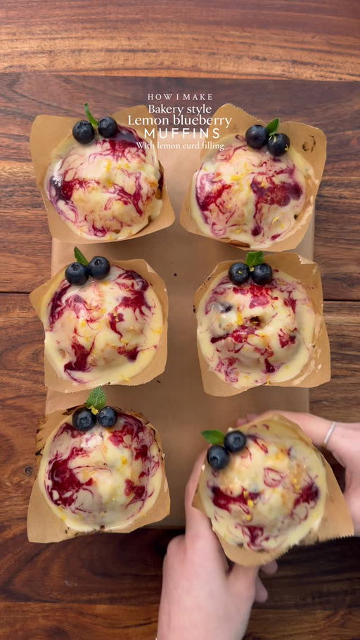 Extremely addictive Bakery style Lemon blueberry muffins with lemon curd filling🤤🍋🫐

INGREDIENTS :
FOR MUFFIN 
•200g caster sugar
•115g unsalted butter (room temp)
•2 large eggs 
•1 tbsp lemon zest 
•2 tbsp lemon juice 
•1/2 tsp salt 
•205g all-purpose flour 
•1 tsp baking powder
•1/4 tsp baking soda 
•80g Greek yogurt + 30g milk
•150g fresh blueberries
FOR LEMON CURD: 
•2 eggs
��•2 egg yolks
��•80g unsalted butter
��•160g caster sugar
��•Juice & zest of 2 lemons 
LEMON & BLUEBERRY GLAZE 
•60g powdered sugar 
•2 tbsp lemon curd 
•2 tbsp heavy cream 
BLUEBERRY SAUCE 
•1/2 cup fresh blueberries 
•1/2 tsp sugar 

INSTRUCTIONS:
•Make lemon curd: In a saucepan cook eggs, yolks, sugar, butter, lemon juice & zest on low heat, stirring constantly. Cook until thick and smooth (7–10 mins). Strain, cool, then refrigerate.
•Prepare blueberry sauce by cooking fresh blueberries with sugar on a medium heat for 5-6 minutes or until you get thick consistency. Strain, cool and keep it aside.
•In a bowl sieve flour, baking powder, baking soda & salt.
•In a separate bowl cream butter & sugar using electric hand mixer until light and fluffy
•Add eggs one at a time, mix well. Mix in lemon zest & lemon juice.
•Add dry ingredients and milk+ yogurt mixture in wet ingredients in batches, gently fold.
•Toss blueberries in a little flour, fold into batter.
•�Divide the batter evenly into a lined muffin tin. Bake at 425°F (220°C) for 5 minutes, then reduce the oven temperature to 375°F (190°C) without opening the oven.
Continue baking for 15 minutes, or until a toothpick inserted into the center comes out clean. Remove from the oven and let it cool for 5 minutes 
•Mix powdered sugar, lemon curd & cream until smooth and glossy. For an extra silky finish you can strain it. 
•Fill the muffins with lemon curd, then top with the prepared icing and a drizzle of blueberry sauce 🫐🍋 ENJOY! 
NOTE:
* ��Avoid overmixing the batter to ensure soft, tender muffins.
* �The initial high baking temperature helps create a beautiful domed top.

#lemonblueberry #muffin #fyp #explorepage #viral