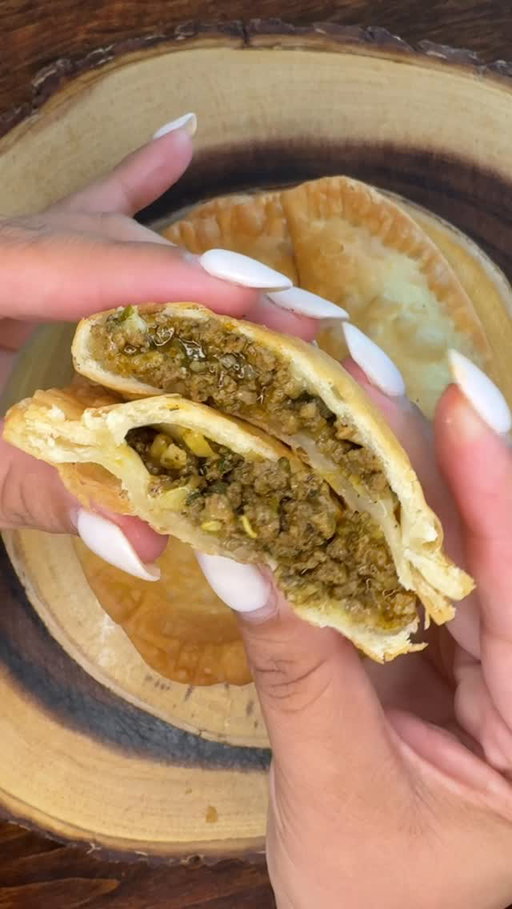 Beef & Cheese Pastelillos Recipe 🥟

* 1.16lbs 85% ground beef
* Sofrito
* Packet sazon or 1/2tsp annato, 1/2tsp paprika, & 1/4tsp turmeric 
* 1tsp onion powder
* 2tsp garlic powder
* 2tsp oregano powder (I used Dominican oregano) the best 
* 1/2tsp black pepper
* Adobo to your salt taste
* 1/4 can of tomato sauce 
* 10 pack grande empanada disc
* American white cheese thinly sliced at the deli, I don’t like mozzarella or mixed cheddar cheese for the empanadas 
* Oil to fry