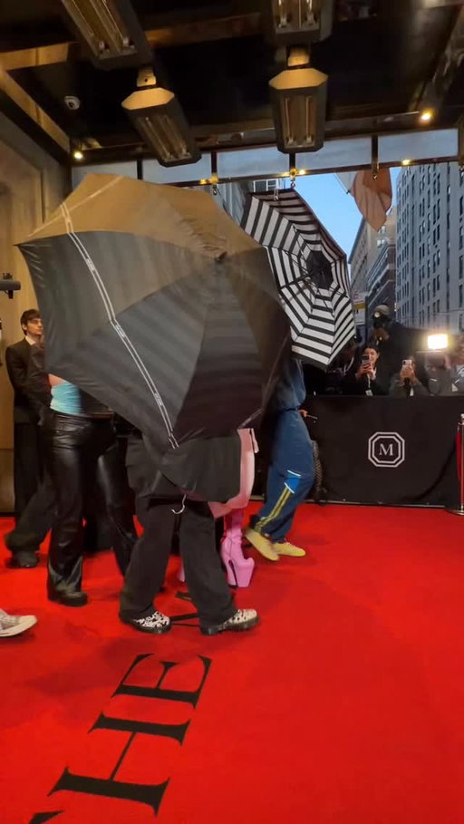Guess who? @iamcardib sneaks out of @themarkhotelny on her way to the Met Gala with only her pink sky-high platforms on display. 

Video: @hey_imlara