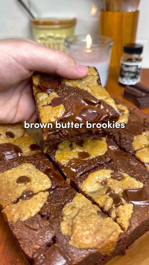 Brookies 🤎 (brownies + cookies)

Comment “Recipe” and I’ll send you the full recipe card with more details for free!!

For all of you asking about the app, search “Osta” on the app or Google play store 🙏

Fudgy brownies layered with the BEST brown butter cookies…. I tested way too many recipes and this is the clear winner 👑

Brown Butter Cookie Dough:
-1 cup brown sugar + 1/2 cup white sugar
-1 cup unsalted browned butter
-2 large eggs, room temp
-2 tsp vanilla bean paste
-2 cups all-purpose flour
-3/4 tsp baking soda
-1/4 tsp baking powder
-1/4 tsp salt
-2 cups semi-sweet chocolate

Brownie Batter
-1/2 cup salted butter, melted
-2 tbsp olive oil
-2 eggs
-3/4 cup flour
-1/2 cup brown sugar + 1/4 cup white sugar
-1 tsp vanilla
-1 cup chocolate chips (melted)
-1/4 cup cocoa powder

For on Top:
-3 oz semi-sweet chocolate chunks

Instructions:

1. Make the cookies first: Brown butter and let cool slightly. Whisk with sugars with the browned butter until glossy, then add eggs and vanilla. Sift in the dry ingredients until just combined, then fold in chocolate. Chill for at least 1 hour.
2. Preheat oven to 350°F (175°C) and line an 8x8 pan with parchment.
3. Make brownie batter: Melt butter with chocolate chips, whisk in olive oil and cocoa powder. In another bowl, whisk sugars, eggs, and vanilla. Combine with chocolate mixture, then fold in flour until just mixed.
4. Assemble: Pour half the brownie batter into the pan and spread evenly. Add chunks of cookie dough across the surface (don’t cover fully). Pour remaining brownie batter over top, then finish with more cookie dough pieces pressed lightly on top. Lastly, top with the chocolate chunks to your liking.
5. Bake for 30–40 minutes, until edges are set and center is slightly soft. A toothpick should come out with moist crumbs, not wet batter. Keep baking if needed!! 
6. Cool completely before slicing (this is key for clean layers).