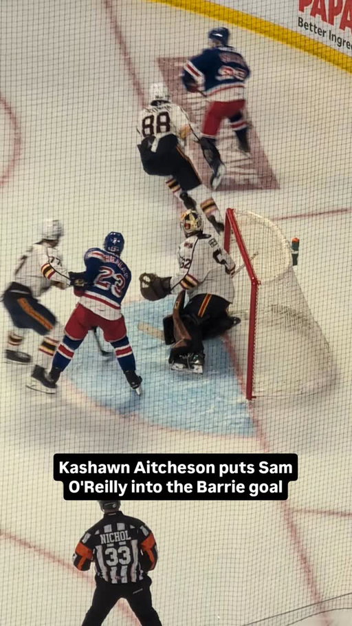 Kashawn Aitcheson puts Sam O'Reilly into the Barrie goal.

#ohl