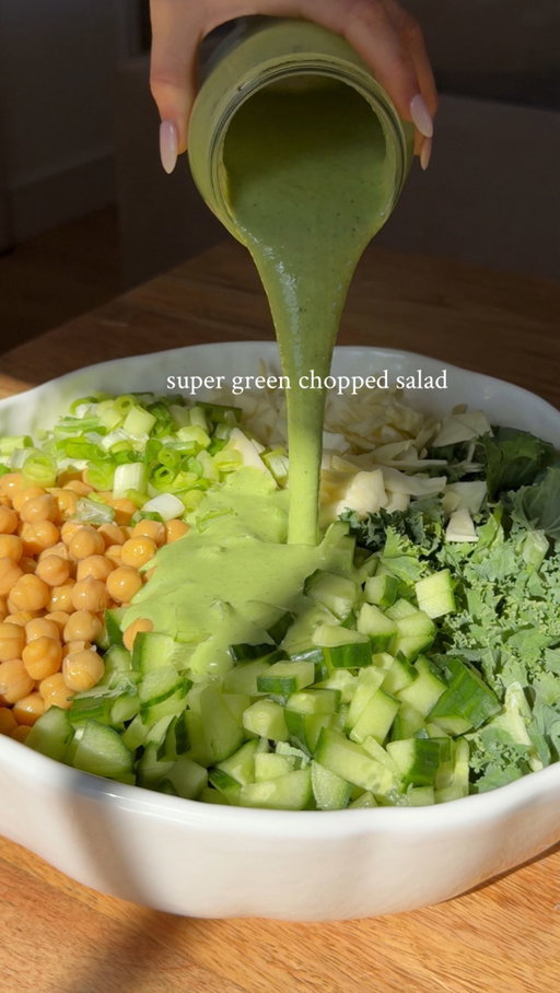 super green chopped salad 🥬
recipe serves 4 
100g kale (chopped)
1/2 a white cabbage (chopped) 
4 spring onions (sliced) 
1/2 a cucumber (chopped finely) 
1 can of chickpeas 

for the dressing: 
3-4 tbsps coconut yoghurt 
2 lemons (juiced) 
2 tbsps tahini 
3 tbsps olive oil 
30g basil 
30g parsley 
1 clove of garlic 
160ml coconut milk 
salt & black pepper 

method: 
chop all your veg, wash & drain your chickpeas and place them all in a large salad bowl. 

to make the dressing place all your ingredients into a blender season generously with salt & black pepper and blitz until smooth. 
pour all over the veggies with some extra olive oil if desired and mix together until well coated! 
I like to serve mine up with some @ryvitauk 
enjoy guys 💚

#veganrecipes #healthyfood #summerrecipes #wholefoods #fibre