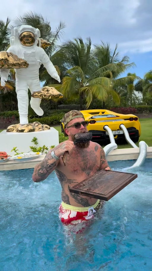 Jake Paul taking a bath in his super car hot tub with steak, oysters, crab legs, and W body wash.