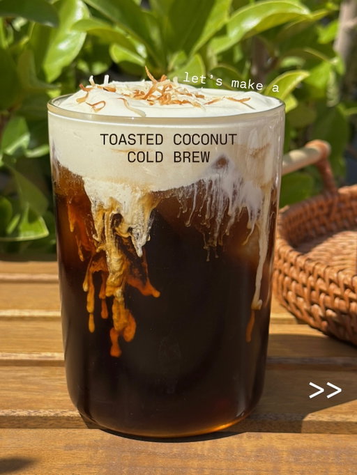keep swiping for how to make this toasted coconut cold brew ☕️⚡️cold brew at the base, with a little bit of depth from the toasty coconut + turbinado sugar and a touch of sea salt to balance it out… perfection!

Toasted Coconut Cold Brew — 1 serving
• 3 tbsp toasted coconut syrup, divided 
• 1.5 oz (45 ml) heavy whipping cream
• ice
• 10-12 oz cold brew
• toasted coconut, for garnish

Toasted Coconut Simple Syrup — yields 8oz, recipe below 
• 1/4 cup toasted coconut 
• 1/2 cup sugar (I used turbinado)
• 4 oz (120 ml) water 
• a pinch of sea salt 

Start by adding 1 tbsp of toasted coconut syrup and heavy whipping cream (or non-dairy alternative) to a small cup and froth until light and airy but still pourable (around 30-45 seconds).To assemble your coffee, add your ice, the remaining 2 tbsp of your toasted coconut syrup, and cold brew to your glass. Top with your toasted coconut sweet cream and garnish with some toasted coconut. Stir & enjoy!

Toasted Coconut Syrup:
If your coconut isn’t already toasted, you can either put it in the oven in the “Broil” setting it for 1-2 minutes (keep an eye on it!) or toast it in your pan over medium heat until it turns golden brown. Then, add in your sugar, water, and sea salt to your small saucepan and heat on medium-high until it comes to a boil, stirring often. Next, reduce the heat and let it simmer for 5-7 minutes. Once simmered, strain into an airtight container, let it cool and store in the fridge for up to 1 month. It’s normal for coconut oil to solidify on top as the syrup sits. You can save that to use for other things or just toss it!

#coconut #coffee #coldbrew #homemade #homecafe