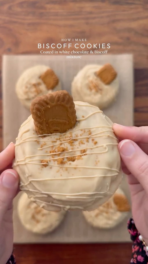 A rich Biscoff-filled cookie, wrapped in smooth white chocolate and Biscoff for every bite to melt perfectly🤤

Yields: 7-8 Cookies 
INGREDIENTS:
•115g cold chopped unsalted butter
•60g caster sugar
•80g light brown sugar
•100g Biscoff spread
•1 whole egg + egg yolk 
•¼ tsp salt
•1 & ½ tsp baking powder
•¼ tsp baking soda
•½ tsp vanilla
•250g - 260g plain flour
FOR COATING:
•250g white chocolate
•1 tbsp biscoff spread

INSTRUCTIONS:
•Cut cling wrap into small squares. Scoop 1 tsp biscoff spread onto individual cling-wrap squares. Fold to seal and freeze until solid. (Repeat for however many stuffed cookies you plan to make.)
•In a large mixing bowl, add the cubed butter and whisk until slightly creamy. Add the white sugar and light brown sugar, then whisk together until well combined and then add Biscoff spread and mix again.
•Add egg + egg yolk. Whisk until fully incorporated.
•Add the vanilla bean paste, baking powder, baking soda, and salt. Gently mix and then add flour and gently mix again until just combined, do not overmix.
•Portion the dough into 70g balls. Press a frozen Biscoff spread piece into the centre of each dough ball, seal well, and roll into a smooth ball.
•Place the cookie dough balls onto a tray and freeze for at least 1 hour (or overnight for best results).
•Preheat (fan) oven to 175-180C (350°F). Bake for 10-15 minutes or until the tops are lightly golden while the centres remain soft.
•Remove from the oven and let cool completely.
•Melt the white chocolate with Biscoff spread using double broiler method
•Spread a layer of melted white chocolate biscoff mixture onto baking paper, just enough to coat the base of the cookie. Gently place the cooled cookie on top, then spoon more of the mixture over it, making sure the cookie is fully covered and evenly coated. Decorate the cookies by inserting half biscoff biscuit and drizzle the same mixture on them.
•Let the white chocolate biscoff mixture set completely before serving, Enjoy! 
NOTE: Store any extra dough balls in an airtight container or freezer bag and freeze for later. Whenever a cookie craving hits, bake straight from frozen🫶🏻