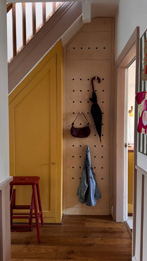 AD. Turning an awkward hallway corner into something that’s pretty and practical. Inspired by @interiordesignmasters , I wanted to create something multifunctional so l hacked kitchen cabinets into a hidden cupboard that doubles as a pegboard. 

Now it stores all the everyday hallway bits... and secretly hides our cleaning stuff too. What do you think?

Materials:
• Flat-pack kitchen cabinet (60 x
200cm) with legs 
• Wall cabinet (60 x 60)
• birch Plywood boards x2
• Drill + sander
