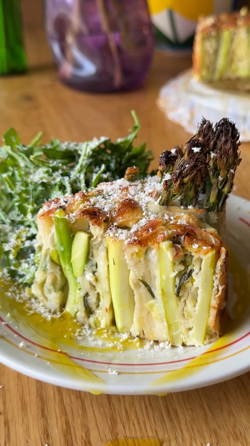 If quiche and spanakopita had a springtime love child, this would be it 🫶🏼

This asparagus filo rose quiche is somewhere between a savory pie and a baked pasta rose. No cooking the asparagus, no dough making, just assembling everything and letting the oven do its thing. 

The filo gets perfectly crispy on the outside, the center stays creamy, and I used my go-to @organicvalley butter, cheddar, eggs, and cream because recipes like this really depend on good ingredients doing their thing.

Serve it with a big lemony arugula salad and try not to eat half the pan standing over the counter before everyone even sits down. Couldn’t be me.

YASSS!

Ingredients- 

For the filo rolls:
12 filo sheets
40-50 asparagus, peeled 2/3 from the bottom
1 leek, thinly sliced
1 bunch of scallions, thinly sliced
113 gr @organicvalley raw sharp cheddar, grated
113 gr @organicvalley salted butter, melted

For the batter:
350 gr @organicvalley heavy cream
50 gr yogurt
2 @organicvalley pasture raised eggs
2 tbsp flour
1 tbsp pecorino romano
Salt and black pepper

For serving:
Pecorino romano
EVOO
Aurgula salad

Method-
1. Preheat your oven to 420°F / 215°C.
2. Place 2 filo sheets on a cutting board and brush with melted butter. Arrange 1/3 of the asparagus, sprinkle 1/3 of the leeks and scallions, and grate 1/3 of the cheddar on top. Cover with 2 more filo sheets, brush with melted butter, and roll into a thick log. Repeat twice with the remaining ingredients.
3. For the batter, mix all ingredients in a bowl until combined.
4. Cut the rolls into 3–4 inch pieces and shape into roses.
5. Arrange the roses tightly in a 9-inch springform pan.
6. Slowly pour the batter over the roses.
7. Bake for 25–30 minutes.
8. Remove from the oven and let the quiche rest in the pan for 20 minutes before cutting and serving.