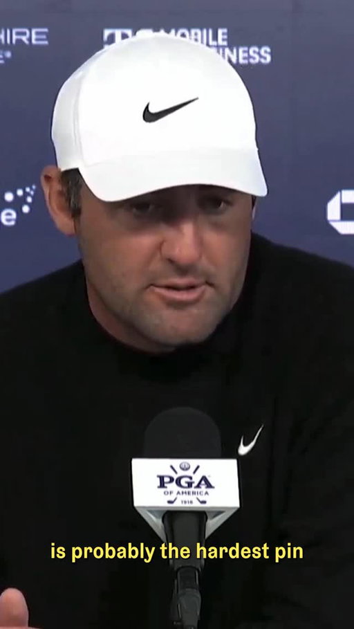 Scottie Scheffler weighs on the pin positions during the second round of the PGA Championship.