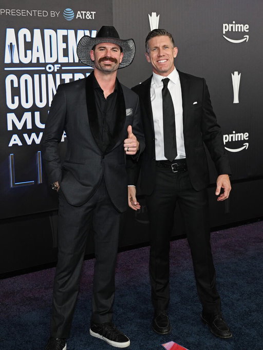 Just a couple of dudes, being bros, giving awards to Brooks and Dunn. Live is crazy.