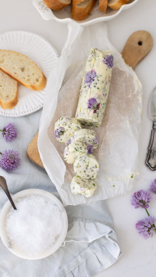 PART 2 of my chive series is here… and it’s the prettiest butter on the internet. 💜🧈

And trust me, you do NOT want to miss part 3 where I make the most stunning purple chive blossom vinegar… it literally turns purple. Follow along, mes amis. 

Here’s how to make my Chive Blossom Butter:

INGREDIENTS

1 cup unsalted butter, softened
1/3 cup finely chopped fresh chives
1/4 cup chive blossoms, gently rinsed
1 tsp flaky sea salt

1. Soften the butter: Let sit at room temp until spreadable.
2. Prep the chives & flowers: Finely chop chives and gently pull apart chive blossoms into small petals.
3. Mix: Stir butter, chives, blossoms, salt, and pepper together until evenly combined.
4. Shape & chill: Form into a log using parchment or press into a ramekin. Chill for 1 hour until firm.

Once it’s ready, serve it on a warm baguette, melted over vegetables, or added to your next charcuterie board… 

And if you need a last-minute hostess gift? This is it. Très belle!

#diy #homemade #hostessgift #chiveblossoms #chives