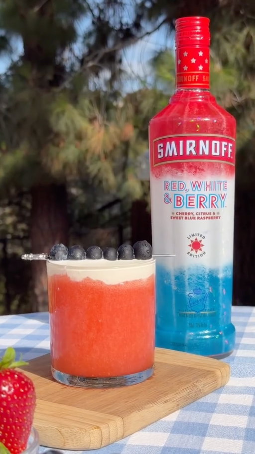 Berries on Vacation 🍓🤍🫐
#ad I partnered with @smirnoffusa to bring you this frozen cocktail, full of summer flavor! 

This cocktail is a frozen strawberry limeade, topped with a salted coconut whipped cream for a fun contrast in flavor and texture. Garnish with blueberries and you’ll have a visually striking red white and blue cocktail for celebrating America’s 250th anniversary!

So grab a bottle of @smirnoffusa and impress your friends with this summer treat! 

Cocktail recipe:
1 1/2oz Smirnoff Red White and Berry Vodka 🇺🇸
1oz Lime Juice 🍋‍🟩 
2 Strawberries 🍓 
1 tbsp Sugar 🍭 
1/4tsp Xanthan Gum 🤍
1 cup Crushed Ice 🧊 

Coconut Cream Top:
3oz Heavy Cream 🥛 
1oz Coconut Syrup 🥥 
1 pinch Salt 🧂 

Blend first four ingredients without ice to dissolve sugar. Then add xanthan gum and crushed ice before blending again. For the cream top add ingredients to a squeeze bottle and shake until slightly thickened. 

Sip Responsibly. Don’t share w/under 21.
#frozencocktail #cocktailrecipes #summercocktails