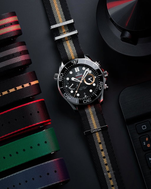 The Seamaster Diver 300M Chronograph 007 First Light. Crafted in stainless steel, with black ceramic dial and pushers, and PVD bronze gold details. Wear it on the exclusive new NATO Strap, or six other game-inspired choices that are available separately within our range.

#OMEGA
#Seamaster
#BondWatch
#EarnTheNumber 
#007FirstLight