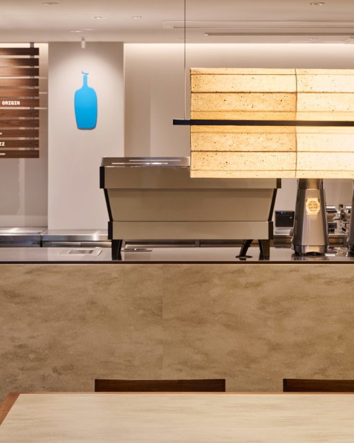 We are excited to announce that our Kamakura cafe is opening on Friday, May 29.

Our design for this special cafe was inspired by the scenery of the Ancient Capital, Kamakura, and brought to life by Yasuo Imazu of ninkipen!, marking his first cafe design for Blue Bottle Coffee. Upon stepping inside, your eyes are drawn to the striking stainless steel ceiling. Inspired by the glimmering light and shadow of a lotus pond reflected beneath the pilotis ceiling of the Tsurugaoka Museum, it delicately mirrors the cafe’s atmosphere. Throughout the space, the lighting and select walls feature washi paper dyed with coffee, while the sofa fabric is rendered in hydrangea hues, evocative of early summer in Kamakura. By weaving the essence of the city’s history and culture with signature Blue Bottle materials, we have created a space uniquely tied to this destination.

Tucked away from the bustling streets, just down a quiet path, a sanctuary awaits. We invite you to embrace the local charm of Kamakura and enjoy a beautiful moment with our carefully crafted coffee, a food menu thoughtfully prepared to complement your cup, and a space designed to slow down. 

Blue Bottle Coffee Kamakura Cafe 
Opening Date: Friday, May 29 
Address: 1F Phil Park Kamakura, 2-8-34 Komachi, Kamakura, Kanagawa 
Hours: 8 am – 7 pm 
Access: A 3-minute walk from Kamakura Station (JR Yokosuka Line / Enoshima Electric Railway)