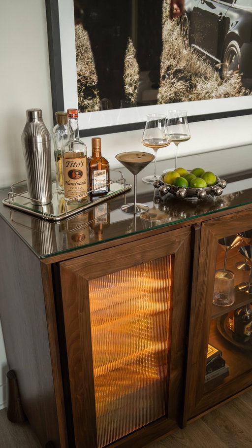 Happy hour at home just got a big upgrade. 🥂 the Ruskin Sideboard from @wineenthusiast is not only a gorgeous piece of furniture (with fluted glass, amber LED’s, tempered glass top and a walnut finish), but an integrated double fridge for drinks and wine bottles.

Wine and beverage fridges that are stylish and don’t stick out can be hard to find and this one blends beautifully with all of my current furniture and the tone of wood is gorgeous. So in love with this new piece and can’t wait to craft many cocktails and pour many glasses of wine here for friends. ✨