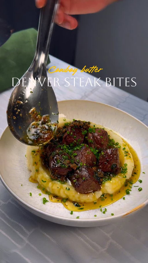 Recipe Denver Steak Bites w/ Cowboy butter 🤠 

You’ll need:
Steak: 1.5–2 lb Denver steak (cubed), salt, black pepper, 2 tsp garlic powder, 2 tsp smoked paprika (opt), 2–3 tbsp oliveoil 
Cowboy butter: 1 stick butter, 2–3 tbsp parsley, 2–3 cloves garlic (minced), 1 tbsp Worcestershire, 1 tsp lemon juice, chili powder ,salt to taste.
Mash: 2 lb potatoes (Yukon gold), 4–6 tbsp butter, 1/2–3/4 cup milk/cream, salt + pepper

Steps:
1. Mash first: Boil cubed, salted potatoes 15–20 min. Drain and mash with butter + milk/cream. Season. Keep warm.
2. Sear steak bites: Pat steak dry. Season with salt/pepper + garlic powder + paprika. Sear in a very hot skillet in batches until browned, 2–3 min total. Remove to a plate.
3. Cowboy butter + deglaze: Turn heat to medium-low. Add a splash of water/stock (or extra Worcestershire) and scrape up browned bits. Stir in butter + garlic + parsley + Worcestershire + lemon zest and juice. Return steak and toss to coat.
4. Serve: Spoon mash into bowls and top with steak bites + pan cowboy butter.

#reels #explore #steakbites #cowboybutter #simplerecipes
