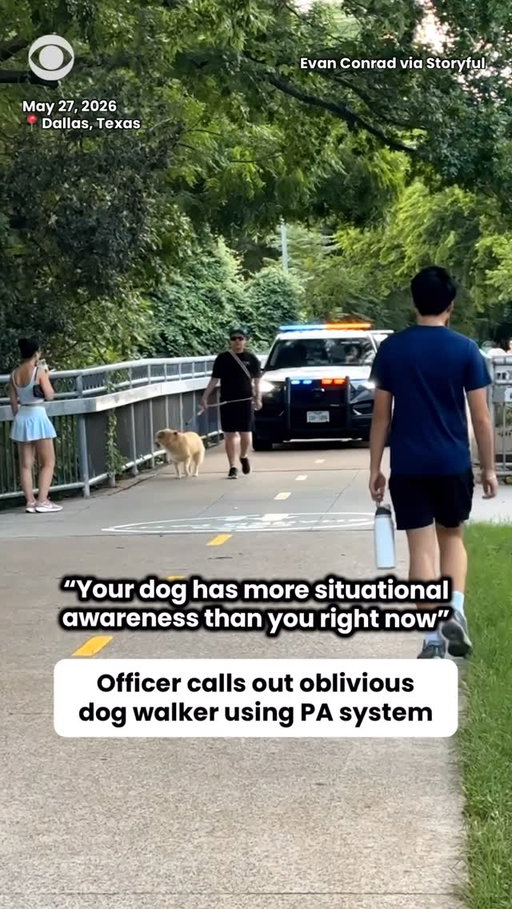 An officer called out an oblivious dog walker as he obstructed police from driving through in Dallas, Texas.

“Your dog has more situational awareness than you right now,” the officer said using a PA system.