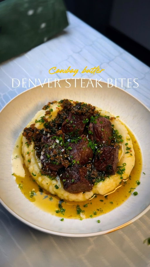 True story 🙄 Denver Steak Bites w/ Cowboy butter 🤠 

You’ll need:
Steak: 1.5–2 lb Denver steak (cubed), salt, black pepper, 2 tsp garlic powder, 2 tsp smoked paprika (opt), 2–3 tbsp oliveoil 
Cowboy butter: 1 stick butter, 2–3 tbsp parsley, 2–3 cloves garlic (minced), 1 tbsp Worcestershire, 1 tsp lemon juice, chili powder ,salt to taste.
Mash: 2 lb potatoes (Yukon gold), 4–6 tbsp butter, 1/2–3/4 cup milk/cream, salt + pepper

Steps:
1. Mash first: Boil cubed, salted potatoes 15–20 min. Drain and mash with butter + milk/cream. Season. Keep warm.
2. Sear steak bites: Pat steak dry. Season with salt/pepper + garlic powder + paprika. Sear in a very hot skillet in batches until browned, 2–3 min total. Remove to a plate.
3. Cowboy butter + deglaze: Turn heat to medium-low. Add a splash of water/stock (or extra Worcestershire) and scrape up browned bits. Stir in butter + garlic + parsley + Worcestershire + lemon zest and juice. Return steak and toss to coat.
4. Serve: Spoon mash into bowls and top with stea

#reels #explore #steakbites #cowboybutter #simplerecipes