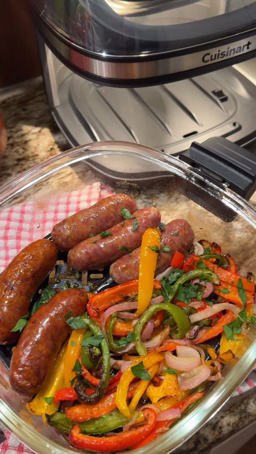 sausage & peppers 🫑 made in my brand new @cuisinart Clearview 4-qt Glass Basket Air Fryer! This air
fryer has become my go to for cooking because it keeps food super juicy on the inside & perfectly crispy
on the outside✨ shop on Amazon! #ad #Cuisinart #aworkofcuisinart #cookingathome