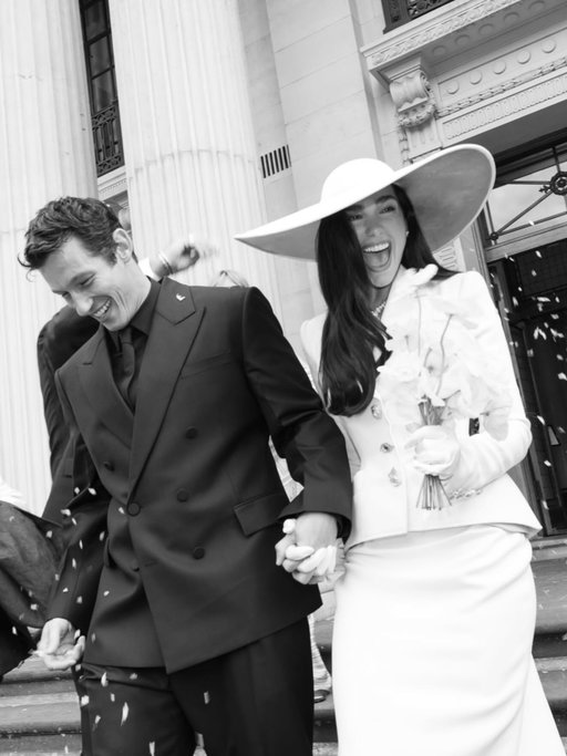DUA & CALLUM

@DuaLipa got married to Callum Turner at Old Marylebone Town Hall in London on Sunday, May 31, in Custom Schiaparelli Haute Couture, designed by @DanielRoseberry.

Dua wears a sharply tailored ivory blazer in cady adorned with personalized gold bijoux buttons, and a matching asymmetric skirt with a sculpted blush bustier trimmed in white lace, paired with white gloves and completed with an oversized hat, lined in gold leaf, designed by Stephen Jones.

Styled by @lorenzoposocco 
Photographed by @madison_phipps 

#Schiaparelli #DuaLipa #CallumTurner