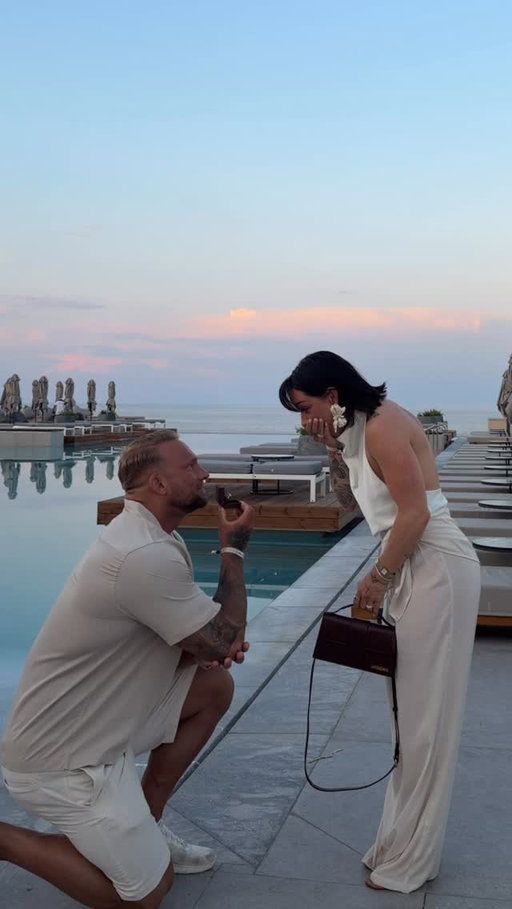 Collins “oh my god!” 😭💍 story time: we were just going to take a picture…I had absolutely no idea what was coming. not a single clue.

he knows I love getting dressed up. he also knows I love to take pictures hehe. and we were on our way to our first dinner in Greece. he suggested we stop for a photo.. which didn’t seem unusual. it wasn’t until the last few seconds that I started to feel like something was up.

standing there in front of our two beautiful kids, (who by the way had passed bedtime a while ago haha) he looked at me and said, “you know I love you, right?” and in that exact moment, I knew. my heart dropped. he got down on one knee. the easiest, most emotional, most beautiful “yes” of my life 🤍

where do I even begin? many of you have been assuming we’re already married. but we just did it all in reverse.

we’ve grown into the strongest team. we share the same passion and we share a deep respect for each other. this man is my life, my safe place, my whole world.

we became partners, parents and each other’s biggest supporters before becoming husband and wife 🤍