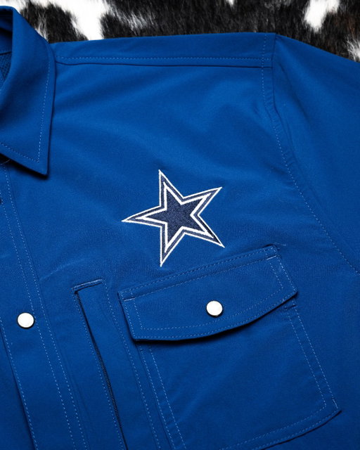 The Star. The Snaps. The Tradition. The Dallas Cowboys Snaps shirt is officially here, featuring the Cowboys star above the front pocket and the Cowboys name stitched across the back.

Built for game days, tailgates, watch parties, and every day you show up in blue and silver. Available now.