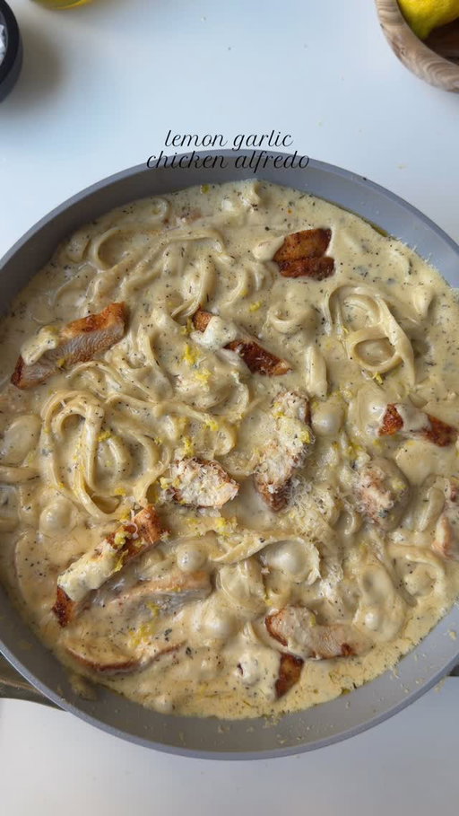 Lemon garlic chicken Alfredo 🍋🧄

Ingredients 

For the chicken:
1 chicken breast, halved lengthwise into even thickness 
Salt to taste
1 tsp smoked paprika powder 
1 tsp garlic powder 
1/2 tsp black pepper powder 
1 tbsp oil ( for marinating ) 
2 tbsp oil for cooking 

For the sauce:

1 1/2 tbsp all purpose flour 
5 tbsp butter 
1 1/2 cup unsweetened heavy whipping cream, room temp
Salt to taste
1/2 tsp black pepper 
1 tsp garlic powder 
1 tsp Italian seasoning 
1 tsp dried parsley 
3/4 cup freshly grated Parmesan cheese 
1 tbsp lemon zest
2 tsp lemon juice 

To assemble:

9 oz fettuccine 
1 cup pasta water

Method: 

Pat the chicken dry and season it with salt, pepper, garlic powder, and smoked paprika powder. Add oil and mix well to combine. Let it marinate for 30 minutes.

Bring a large pot of generously salted water to a boil. Cook fettuccine until al dente. Reserve 1 cup pasta water, then drain.

In a pan add oil add the marinated chicken and cook for 4–5 minutes per side on medium-high heat, depending on thickness.
Remove the chicken in the same pan add butter once the butter is melted. Add the all purpose, flour.  Whisk constantly for 30-40 sec to cook out the raw taste (do not brown). Add in heavy whipping cream. Mix and add salt, garlic powder, black pepper, Italian seasoning, dried parsley.

Simmer gently for 3–4 minutes, stirring, until slightly thickened.
Reduce heat to low, then stir in Parmesan cheese until melted and smooth.
Add lemon zest and lemon juice. Taste and adjust salt or lemon if needed.

Add cooked fettuccine to the sauce.
Add ¼ cup at a time, as needed .
Toss gently, adding reserved pasta water a little at a time until the sauce is silky and coats the pasta beautifully. Add sliced chicken and toss again. Simmer on low for 1–2 minutes to let everything come together. Garnish with extra Parmesan, parsley, or a pinch of black pepper.
Optional: a tiny drizzle of olive oil or butter on top for extra gloss 

#recipe #pasta #chickenalfredo