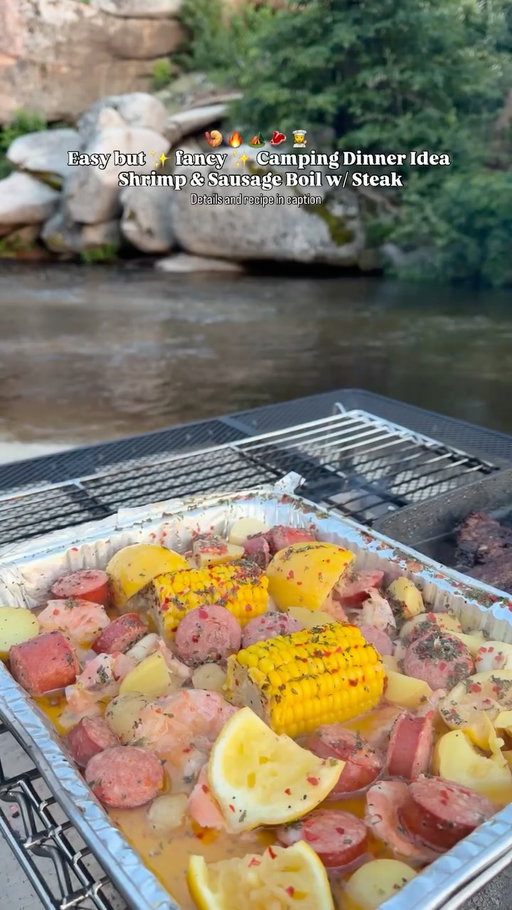 Why have a 5 star meal, when you can have a meal under a million stars ⭐️ 

When I am feeling fancy while camping I whip up this shrimp and sausage boil & grill up some ribeyes too 😅

Here’s how you can too 😉 

Ingredients 🧺 
(This recipe makes enough for 2-4 servings) 
16 oz of JUMBO or COLOSSAL frozen shrimp (I like the one that is easy peel and deveined) 
1 pound of baby potatoes 
1 pound of spicy sausage (I use Farmer John hot links, they have the best snap)
3 sticks of salted butter 
1 head of garlic 
3 large lemons 
2 corn cobs (halved) 
Black pepper 
Chili Flakes 
dried Parsley 
1 can or bottle of beer of choice ( I like using Modelo) 
2 Ribeye Steaks
Olive Oil
Steak Seasoning of Choice 

Directions 📝 
In a large aluminum tray, add in your ingredients 
Shrimp
Potatoes (you can add them whole or cut them up, I like to quarter mine) 
Sausage( cut into rounds) 
Brie in your corn
Butter(cut up into smaller squares) 
Juice of three lemons( you can use more or less if you like, I add in a few lemon peels for extra lemony flavor)
1 head of garlic (you can use less or more depending on your garlic preference)
Season with 1 tbs of black pepper, chili flakes, and dried parsley (use more chili flakes if you like it spicy) 
Pour in your beer 
And cover with aluminum foil and cook her the fire for about 45 minutes or until your potatoes are fork tender 
Season your steaks with your steak seasoning and cook to your liking (the steak dipped in the shrimp boil butter is HEAVEN btw 😅) 

And enjoy 😋 

📍 Musick Creek Falls Hipcamp 🏕️ 
Made on my Around Fire table (check out my last reel for more details on the table 😊) 

For more camping meal ideas, come explore with me @theexplorepaige_ 🫶🏻 

#camping #campingmeals #cookingoutside #cookingoverfire #hipcamp