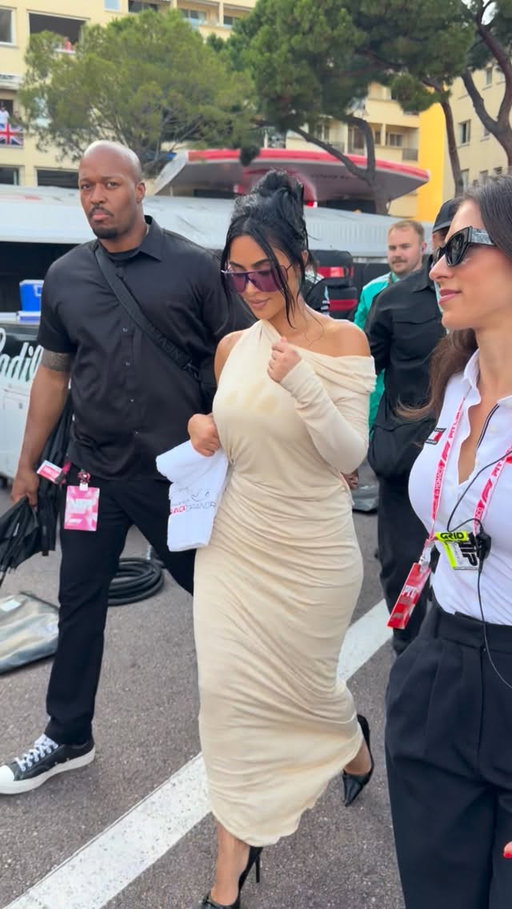 Kim K wearing custom Gucci gets champagne showered at F1 in Monaco!