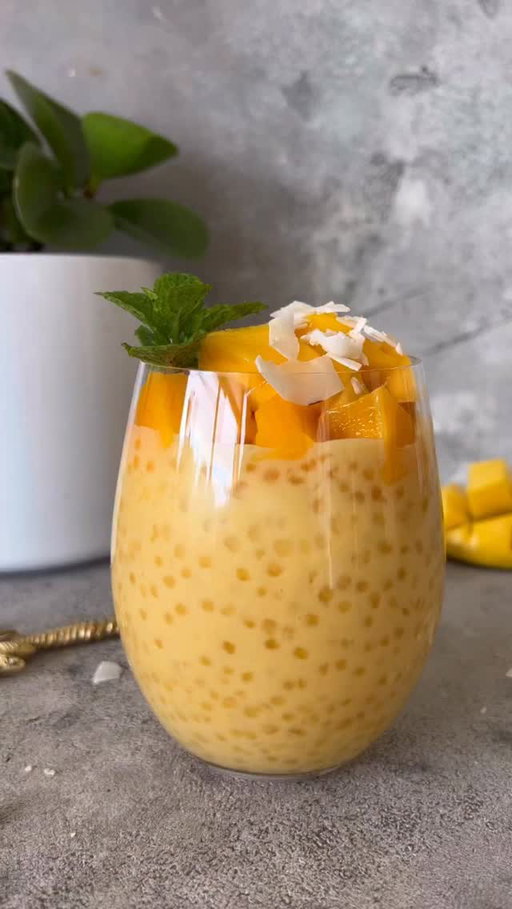 Sharing one of my favourite 
Creamy Mango Sago 🥭anyone ? This is one of my favourite desserts. The tropical flavours are just amazing! 

To make the same: 
Step 1: Soak for 1 hour 1/2 cup tapioca pearls in 3 cups cold water for. 
Step 2: Boil tapioca pearls in 4 cups of water for 15 minutes continuously stirring.
Step 3: Rinse cooked tapioca pearls in cold water 
Step 4: Blend in a high speed blender:
2 mangoes 
1/2 can of coconut milk 
4 tablespoons of coconut yoghurt in Mango flavour 
1 tablespoon coconut sugar 
Step 5:  Mix tapioca pearls with blended mango 
Step 6: Serve in a glass with 2 tablespoons of Coconut Yoghurt on top and fresh mango cubes. 

Drizzle with coconut chips and enjoy! 🥭🥥
.
.
.
#mango #mangosago #sago #mangodessert #easyrecipes