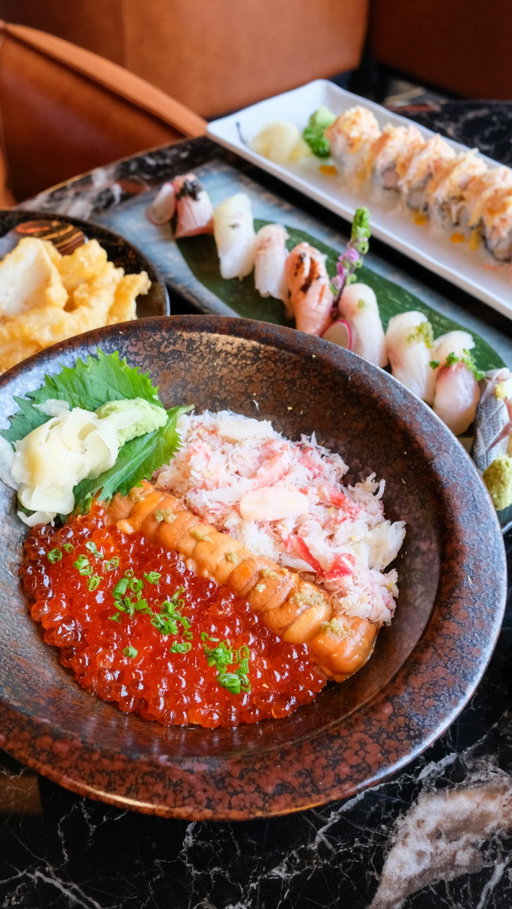 There’s a new sushi and lounge bar in Chinatown, located on the third floor above a dim sum and Chinese restaurant called 100 Feast & Lounge. The space is huge, with a large outdoor patio and plenty of room for groups to gather and watch the game or other events. 🍣 

We tried several tasty dishes, and my favorite was the Seafood Trio, topped with crab, ikura, and uni. We also ordered the Salt & Pepper Calamari, the Chef’s Special Sushi (8 pieces), and the American Dream Roll.
I’ll definitely be back to try the Cantonese dishes served on the second floor!
#nycchinatown #nycsushi #sushinyc #nycrestaurants #nyceats