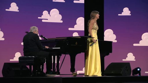 Taylor Swift has a friend in Randy Newman at the world premiere of Toy Story 5!
