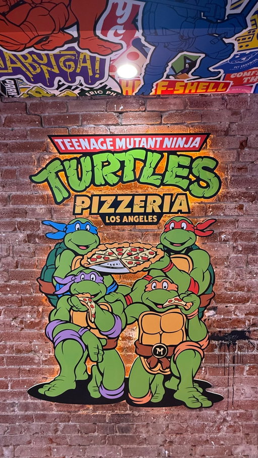 @tmntpizzeriala soft opening June 10, 2026! The excitement that everybody has entering this restaurant was amazing to see! This is the first official @tmnt pizzeria and it’s located in Santa Monica 3rd St., Promenade. With dine-in and bar available everyone can enjoy, and the atmosphere that will take you to the world of the TMNT! 
.
.
#tmnt #teenagemutantninjaturtles #pizza #cowabunga #losangeles