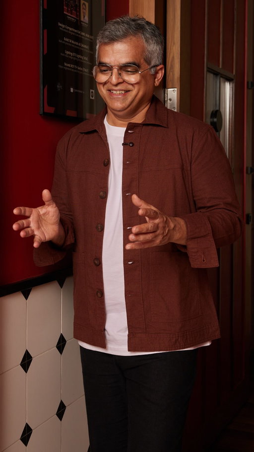 “Fortunately, comedy worked out.”

That’s Atul Khatri’s summary of a series of career moves that never quite happened.

There was a brief attempt at becoming a DJ. That ended when he showed up on time and the instructor didn’t. Bartending was next, until a Sunday afternoon nap got in the way. “My bartending career ended there,” he laughs.

What makes the story funny now is that none of it was really the plan.

Before comedy, Atul spent years in the corporate world. Today, he’s one of the country’s most recognisable stand-up comics. Not because he followed a roadmap, but because he kept saying yes to the things that interested him.

That openness still shows up in the way he approaches life. Curious enough to try something new. Self-aware enough to laugh when it doesn’t work out.

And somewhere between the missed DJ classes, the abandoned bartending course, and a mic on stage, he found the thing he was meant to do all along.

Atul is wearing the Luxe Supima Cotton T-shirt in White, the Seascape Linen Relaxed Pants in Black and the Aven Cotton Linen Shacket in Brown.
Check out his look at the link in our bio.

This is Creators | A series that features trailblazers we admire for going against the grain & making waves in their own spaces.

#BombayShirtCompany #Creators #AtulKhatri #StandUpComedy