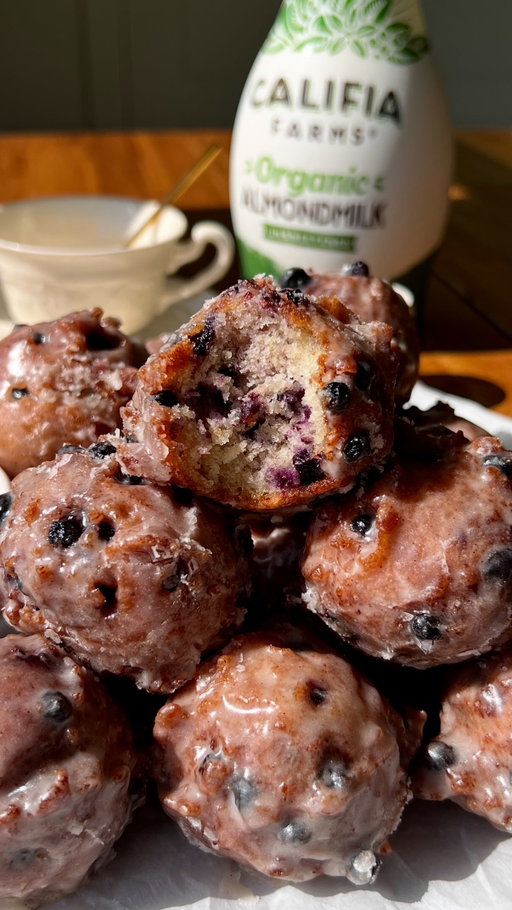 truly like little bites of pure happiness and i couldn’t be more in love 🥹🫐 recipe below OR comment ‘RECIPE’ to get the link sent to you 🤎

Sourdough Blueberry Fritter Bites:
- 2 cups (260g) all-purpose flour
- 1/3 cup (70g) granulated sugar 
- 2 tbsp (30g) light brown sugar
- 1 tbsp (12g) baking powder
- 1 tsp (6g) salt
- 1/2 cup (120ml) @califiafarms Organic Almondmilk, room temp
- 1/2 cup (140g) sourdough discard, preferably room temp
- 2 eggs, room temp
- 1 tsp (4g) vanilla extract or paste
- 2 tbsp (28g) salted vegan butter, melted & slightly cooled
- 1 1/4 cups (180g) wild or regular blueberries, fresh or frozen
- Avocado oil, for frying
Vanilla Bean Glaze:
- 3 cups (360g) powdered sugar 
- 12 tbsp (170g) salted vegan butter, melted 
- 1/4 cup (60ml) Califia Farms Organic Almondmilk
- 2 tsp (8g) vanilla extract or paste
- Pinch of salt 

Instructions:
Glaze: In a large bowl, whisk together the powdered sugar, almondmilk, melted butter, vanilla & salt until smooth. Set aside.
Fill a large, heavy-bottomed pot or Dutch oven with oil, filling ~2” in the pan. Heat on medium-high until it reaches 360F-370F.
Line a wire cooling rack w/ a thick layer of paper towels.
Fritter Batter: In a medium bowl, whisk together the flour, both sugars, baking powder & salt. Set aside. 
In a separate large bowl, whisk together the almondmilk, sourdough discard, eggs & vanilla until combined. Then stream in the melted butter as you whisk, until incorporated.
Add the dry ingredients to the wet, & fold until just combined. Add the blueberries & very gently fold until evenly dispersed. Set aside.
Once the oil is hot enough, use a medium cookie scoop (2 tbsp; 1oz; #40) to scoop the batter & carefully drop it directly into the oil. Add 6-8 at a time, frying for 1-2 mins on each side, until golden. 
Using a slotted spoon or tongs, carefully remove the fritters from the oil & transfer to the rack with paper towels. Allow the oil to return to the correct temp before repeating w/ the remaining batter.
While the other fritters are frying, dip the warm fritters into the glaze, generously coating all sides. Place onto a cooling rack to let the glaze set. 
Serve & enjoy!

#califiapartner
