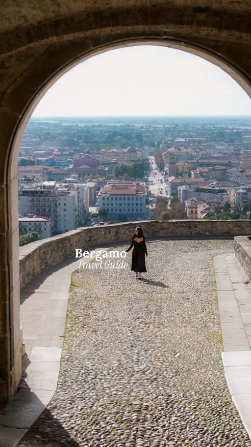A DAY IN BERGAMO 🇮🇹🍝 SAVE & SHARE! 
 
 ☕️Start your day with a cozy stay and a delicious breakfast at @palazzosantospirito 

 🚗Enjoy a TukTuk experience and a guided tour of Upper Bergamo @tuktuk.bergamo_official 

 🤎Wander through the charming streets of Città Alta .

🏛️Visit Piazza Vecchia  and walk along the Venetian Walls.

 🍝Take a cooking lesson and have lunch at Nonna Alda  restaurant @nonnaalda_cucina_bergamasca 

🔔Visit Basilica di Santa Maria Maggiore  and the Rocca di Bergamo  fortress.

🍦Savor some stracciatella  ice cream at La Marianna, the birthplace of this iconic flavor!

 🏛️Stroll around Porta San Giacomo

 🍷Enjoy a guided tour, tasting experience, and aperitivo at Cantina Martinelli  in Scanzorosciate @cantinamartinelli_ 

 🍕End your day with dinner at  restaurant.
@alvecchiotaglierebergamo Restaurant 
 
🛬 Bergamo has its own airport, and it’s located just 40 minutes from Milan 🚆and 2 hours from Venice! 🚗

Add this amazing city to your Italian bucket list 🇮🇹🏛️

🇮🇹
———-

 #visitbergamo #bergamo #italy🇮🇹 #venetianfortress #travel European city |  best city to visit in Italy | magical places in Italy | day trip from Milan | best things to do in Bergamo | hidden gems in Italy