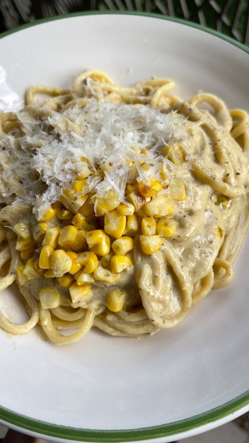 Jokes aside, Italy, I love your food sm it just gives me cramps ✨🫶

This buttery, toasty, creamy corn cacio e pepe is for my pasta loving friends who want a little less cheese but just as much indulgence. It’s so easy to whip up and makes a gorgeous summer dinner. It is wholly untraditional but sometimes as vegans we have to work a little harder to make magic. Yes it takes a few more ingredients but it is absolutely worth it. 

RECIPE for 2-3:

75g cashews, soaked for 20 minutes in boiling water
25g vegan butter
1 small onion, finely chopped
2 cloves garlic, finely sliced
200g corn (preferably off the cob)
1 tbsp white miso paste
10g nutritional yeast
100ml soy milk

1 tbsp vegan butter
½ tbsp olive oil
¾ -1 tsp coarsely ground black pepper 

200g pasta of choice

1. Heat a large pan over medium heat. Melt the vegan butter then add the diced onion and fry with a pinch of salt until translucent. 

2. Add the corn and fry for around 5-6 minutes with the onions until softened.

3. Add in the garlic and fry for a further minute or so.
Place the pasta onto a boil with plenty of salt.

4. Tip the cashews and corn mixture into a blender with the miso, nutritional yeast and soy milk. Blend until completely smooth then season to taste (don’t add too much salt as you’ll be adding salty pasta water to the sauce later).

5. Fry the vegan butter and olive oil in a frying pan over a medium low heat. Add the black pepper and fry until sizzling and aromatic.

6. Add the pasta sauce to the pan with plenty of pasta water and stir to emulsify. Drop in the cooked pasta and stir it all together until creamy and saucy (more pasta water helps form a loose sauce that clings to the pasta). 

7. Serve with more nutritional yeast or vegan parmesan and enjoy!

#veganpasta #easypasta