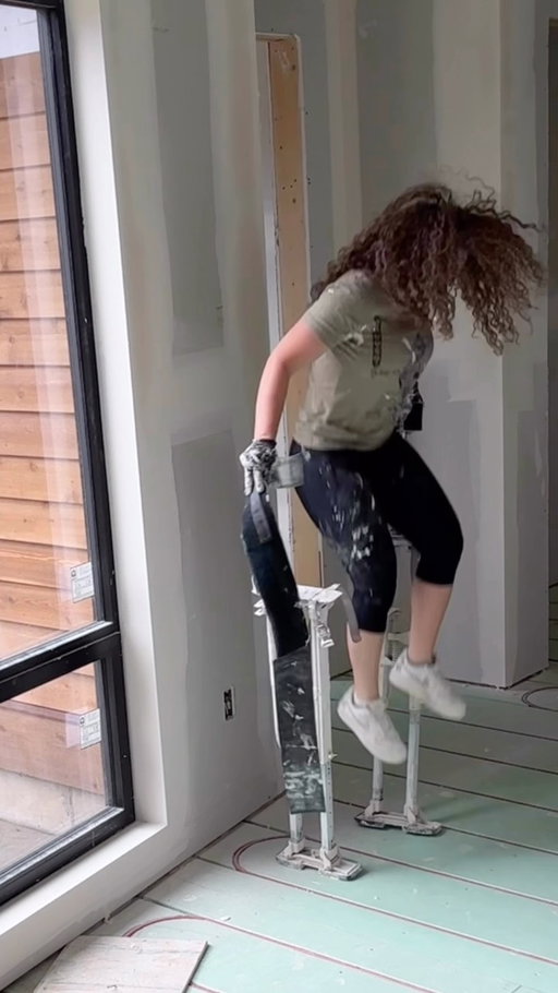 I know it looks crazy but this is a super easy way to get down off stilts! #reels #drywall #explore