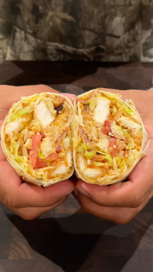 Hot Honey Chopped Wraps 🌶️

These wraps are so simple, yet so delicious. Spicy hot honey chicken tenders get piled onto a bed of bacon, lettuce, tomato and cheese. That all gets chopped up, drizzled with hot honey, and stuffed inside of a tortilla

@Cusos Hot Honey Seasoning really brings this one all together

Follow @domtuttobene to instantly make you a better cook at home 🏠 

Ingredients: 
- Hot Honey Chicken Tenders 
- Bacon 
- Lettuce 
- Tomato 
- American Cheese 
- Hot Honey

Hot Honey Coating: 
- @Cusos Hot Honey Seasoning 
- Butter 
- Sriracha
- Honey 

Instructions: 
- Place Chicken tenders into the air fryer or convection oven at 375 for 10 minutes shaking halfway
- Place 1 package of bacon on a baking sheet and bake at 400 for 12 minutes until crispy. Remove and drain on a paper towel lined plate 
- In a pan, melt butter, and add honey, sriracha and hot honey seasoning. Stir on low heat until combined 
- Once crispy, toss the chicken tenders in the hot honey sauce 
- Wash and slice a head of iceberg lettuce and a tomato 
- On a cutting board assemble the lettuce, hot honey tenders, bacon, tomato, and cheese
- Chop it all up and mix to combine 
- Drizzle hot honey over the top 
- Mix again and put off to the side in a bowl
- Warm an XL tortilla, and scoop the mixture into the tortilla
- Wrap tightly and toast to seal the bottom for a few minutes in a pan over medium heat 
- Slice and enjoy!! 
- 
- 
- 
- 
#choppedwrap #hothoney #chickentenders #easyrecipe