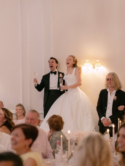 Chapter Four; the Reception! 🥂 
We truly couldn’t have chosen anywhere more perfect to host our reception than the @thecolumbiahotel. The classic white London facade overlooking Hyde Park, with it’s sweeping balconies and grand columns, and a pink, princess-worthy ballroom, yet unknown to most, an infamous past steeped in rock ‘n roll history. It was the perfect blend of us. And the beautiful room decor really was a team effort. Every piece of glassware was vintage or secondhand hand crystal sourced by my mother-in-law, me and my extended family, from all corners of the country. The pink tablecloths and napkins were all 1950’s vintage, brought over in the suitcases of our close family friends in Los Angeles. Dessert was served on vintage gold hostess trolleys, painstakingly upcycled and beautified by my fabulous daddy. And the beautiful florals by @wildehill, the gorgeous table stationery by @miaspaperie and the fabulous flameless candles by @foreverflamesuk tied the whole vision together. We had the wonderful @kevinlee.harp.piano.maestro tinkling all sorts of Disney and musicals all afternoon. A tremendous thank you to @ladureeuk for providing my DREAM monogrammed macaron pyramids as a wedding gift! Our speeches were out of this world- our dream best men duo actually wrote us a song which no one has been able to stop singing since! And the best treat of all… we couldn’t have a wedding without honouring the place we met and the place that shaped us into the people we would become- the Sylvia Young Theatre School. It was always our dream to have the incredible children perform the cabaret we ourselves used to perform, and our dream came true. They blew the roof off (and quite literally nearly brought the chandeliers down!) and it was incredibly emotional for us. Thank you @sytslondon we love you forever. More from the reception to come! 🤍