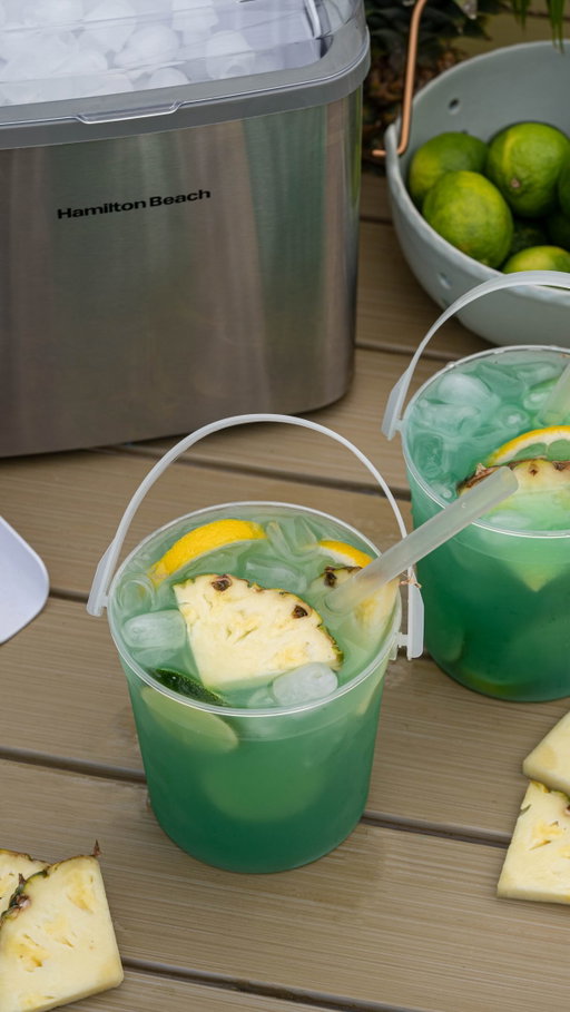 @hamiltonbeach has all the summer essentials like their countertop ice maker.

To keep this summer drink ice-cold, I am using the Hamilton Beach Countertop Stainless Steel Bullet Ice Maker. It produces a fresh batch of bullet-shaped ice in less than ten minutes, which is perfect for hot summer days when you need ice fast. The compact design looks great on the counter, and the bullet ice is hollow, making it ideal for absorbing flavors and chilling your drinks instantly.

Tropical Drink Buckets

5 oz lemonade 
1 oz blue curacao syrup 
3 oz coconut water, or spirit of choice 
4 oz pineapple juice 
Hamilton Beach Ice

Pineapple wedges, lemon and lime slices for garnish

Instructions

Fill a food safe bucket, or a large glass, with Hamilton Beach bullet ice. Pour in the lemonade, blue curacao syrup, coconut water, and pineapple juice. Stir gently to combine the layers and garnish with a fresh pineapple wedge and a lime wheel.

#mocktails #summerdrinks #pooldrinks