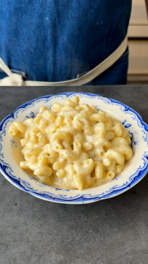 100 Garlic Clove Mac & Cheese
-
1 cup extra virgin olive oil
100 garlic cloves, peeled
¼ cup all-purpose flour
2 cups heavy cream
2 cups whole milk
1 ½ cups grated provolone cheese
1½ cups grated Gruyère cheese
2 teaspoons kosher salt
2 teaspoons freshly ground pepper
2 teaspoons mustard powder
1 lb cavatappi pasta

Add the olive oil and garlic cloves to a large pot and cook over medium heat for 25-30 minutes, until the garlic is completely soft and lightly golden. Meanwhile, cook your pasta according to package instructions in boiling salted water, then set aside. Remove the garlic cloves from the pot. Discard 3/4 of the oil left in the pot. Add the flour to the pot and whisk into the leftover garlic oil over medium heat and cook for 2-3 minutes. Gradually whisk in the milk and heavy cream. Stir in the two cheeses, followed by the cooked garlic, salt, pepper, and mustard powder. Simmer until thickened, then fold in the cooked pasta and serve immediately.