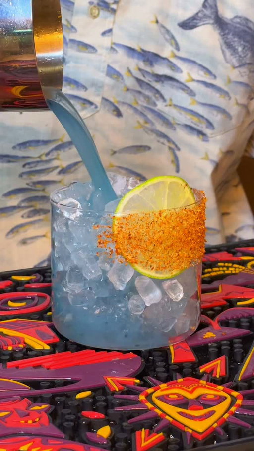 The Gulf of Mexico Margarita 🇲🇽🌊🩵
Did you know that the margarita is the most popular cocktail in America? Of course you can’t have a margarita without tequila (and a few other imported ingredients). 

This is the perfect cocktail to celebrate the upcoming 4th of July weekend! 

This is a really fun spicy pineapple margarita, and I made it blue to match the color of the water in Cancun, America’s favorite vacation destination! 

Cocktail recipe 
2oz Blanco Tequila @madremezcal 🇲🇽 
1oz lime juice 🍋‍🟩 
1/2oz green chili liqueur @anchoreyes 🌶️
1/2oz pineapple syrup 🍍 
Pinch of blue spirulina 💙
Tajin to rim @tajinusa 🌶️ 

#bluecocktail #spicymargarita #cocktailrecipes #gulfofmexico #satire