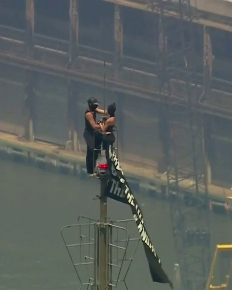 BREAKING: Two masked individuals have climbed to the top of NYC’s Empire State Building and unfurled a banner reading, “When the power of love beats the love of power, the world knows peace.”