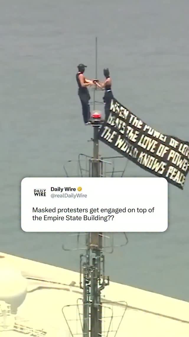 Two masked individuals were spotted on top of the Empire State Building waving a flag saying, “When the power of love beats the love of power, the world knows peace.” 

Then one of the climbers appeared to propose to the other on top of the building.

Reports indicate they were safely brought down and are now in police custody.