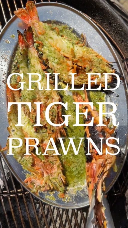 TIGER PRAWNS / CORIANDER LIME CHILLI BUTTER 🦐

Coriander, lime, green chilli butter:
- In a processor put 3 green chillies, 3 garlic cloves, handful Thai basil, large handful coriander, 2 whole spring onions, lime zest and juice of 1 lime, 1 tbsp ground coriander, 1 tbsp ground coriander, and a generous pinch of salt. Process until chopped
- Add 250g pack of unsalted butter, at room temp, and process until combined. Set aside

Prawns:
- Take 4 large tiger prawns. Snip through between the legs, run a knife through, and split in half lengthways (keeping as 1 piece). Remove the sack from the back
- Place on a hot coal BBQ, shell side down until charred and meat is cooked mostly through but not all the way. Remove from heat
- In a tray on the BBQ, melt some of the butter. One melted, cook the prawns flesh side down for 20-30s to finish them

Serving
- Serve the prawns on a platter, covered in the butter, with fresh coriander and lime

#cooking #food #prawns #bbq #summer
