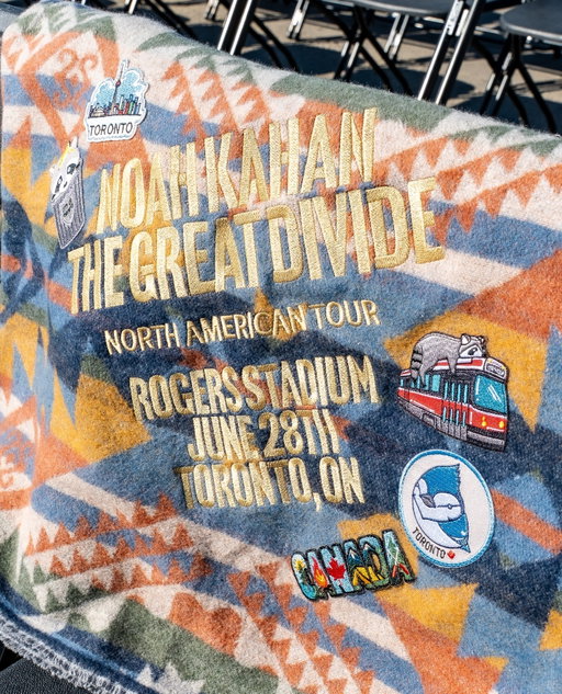 To commemorate The Great Divide North American tour, we gifted @noahkahanmusic a custom Canadian-made camp blanket inspired by his outdoor aesthetic and signature tour patch collection. 

The blanket was embroidered with the Toronto tour date and decorated with thoughtfully curated Toronto- and Canada-inspired patches, creating a one-of-a-kind keepsake that celebrated both the city and the nostalgic, homey, camping theme woven throughout his tour 🏕️