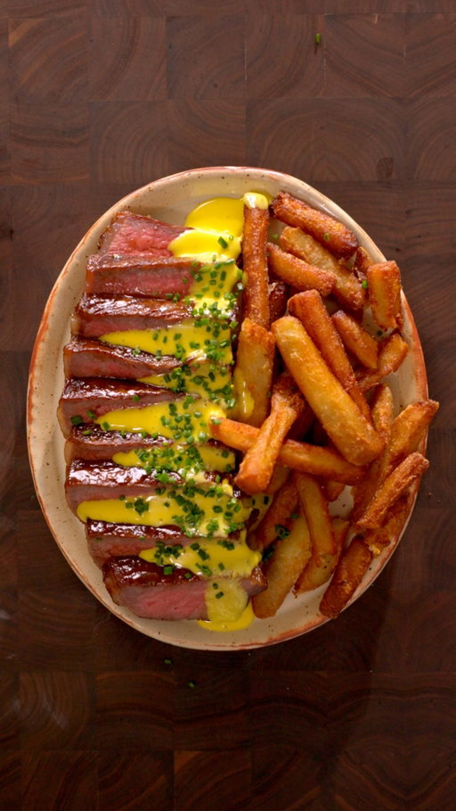 Oh no not a steak frites recipe 😫

Should she forgive him?

Ingredients

French Fries:
- Russet potatoes
- Frying oil
- Salt

Bernaise Sauce:
- 3 egg yolks
- 1 tbsp chopped shallot
- 3 tbsp white wine vinegar
- 1 tbsp chopped fresh tarragon
- 1 cup of clarified butter
- Salt and black pepper
- Lemon juice to taste
- 1 TBSP hot water

Steak:
- Striploin (use whatever steak you like)
- High smoke point oil
- 2 TBSP of butter
- Salt and pepper
- Rosemary and thyme
- Garlic
- Shallots

Instructions

French Fries:
- Cut the russet potatoes into strips.
- Simmer in salted water for about 10 minutes, or until just starting to fall apart. Drain and chill in the freezer.
- Fry at 300°F (150°C) for 5 minutes, then chill again.
- Fry at 355°F (180°C) for about 3 minutes, or until golden brown and crispy.
- Season with salt.

Béarnaise Sauce:
- Reduce the white wine vinegar with the chopped shallots and a sprig of tarragon until reduced by half.
- In a bain-marie, whisk the egg yolks with 1 tbsp of the vinegar reduction until thickened.
- Remove from the heat and slowly whisk in the clarified butter until emulsified.
- Stir in the chopped tarragon and lemon juice. Season with salt and pepper.
- If needed, whisk in 1 tbsp of hot water to thin the sauce.

Steak:
- Dry-brine the steak with salt and refrigerate uncovered for at least 4 hours, preferably overnight.
- Sear in a pan over medium-high heat with a high-smoke-point oil until the internal temperature reaches 130–135°F (54–57°C) for medium-rare.
- Rest for 10 minutes before slicing.